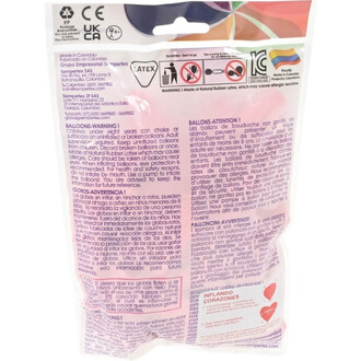 Ballon cœur rose en latex dans son emballage plastique transparent, affichant les avertissements de sécurité multilingues et pictogrammes sur l’emballage.