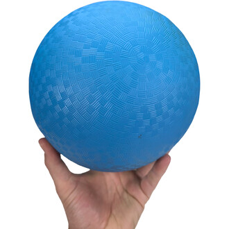The ball is held here in an adult hand