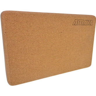 Brique de yoga en liège de couleur beige avec une surface naturellement texturée, affichant le logo AMAYA gravé sur le dessus.