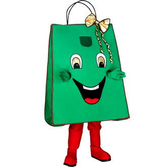 Mascotte en forme de sac cadeau, avec un visage souriant, des yeux grands et ronds, et des bras stylisés. Le sac est vert, orné d'un nœud doré et de détails rouges. La mascotte porte des jambes en collant rouge et des chaussures noires.