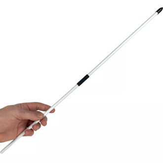 Hand holding a white juggling stick with central black grip and black tips, diabolo tool, flower stick and Chinese plate.