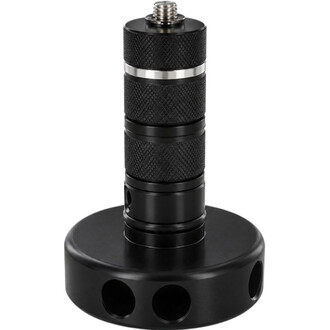 Hub Dragon Ultra Threeworlds en aluminium noir avec tige filetée, corps moleté et base circulaire percée de trois trous pour le montage sur une massue de jonglerie.