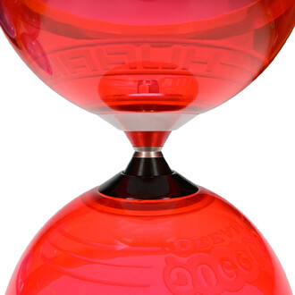 Diabolo Hurricane Extreme avec deux coques transparentes rouges et un axe central argenté, monté sur un support noir.