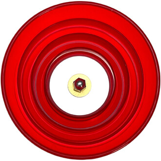 Disque rouge translucide à cercles concentriques avec un écrou central doré et une petite bille rouge au centre.