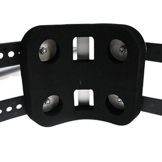 Kit molletière avec fixations pour snow, vue du dessus, montrant une base noire avec quatre roulements métalliques et des ouvertures pour la fixation.