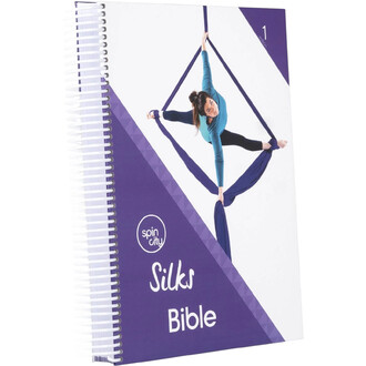 Couverture du livre Silks Bible, carnet à spirale violet et blanc avec une femme en posture d’aérien utilisant des tissus violets.