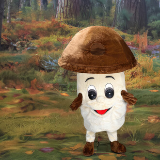 Mascotte en forme de cèpe avec un grand chapeau brun et un corps crémeux. Elle possède de grands yeux expressifs et un large sourire. Le fond montre une forêt colorée avec des feuillages automnaux.