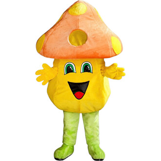 Mascotte représentant un champignon coloré, avec un chapeau orange à pois jaunes et un corps jaune souriant. Elle a des bras ouverts, des yeux expressifs et porte des jambes vertes, créant une apparence amicale et amusante.