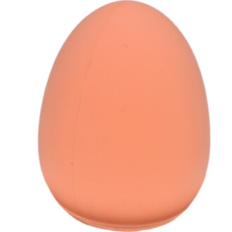 Œuf rebondissant de couleur pêche, de forme ovale, avec une surface lisse et mate.