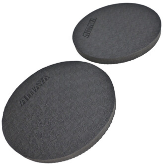 Paire de pads de yoga ronds en mousse, de couleur noire, avec une texture en relief, conçus pour soutenir les genoux et les mains pendant la pratique.