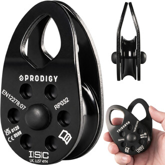 Vista frontal da polia preta Prodigy RP032 com as marcações PRODIGY, EN12278:07, RP032, CE 0598 e ISC, vista lateral mostrando a garganta e vista da polia na mão para comparação de escala.