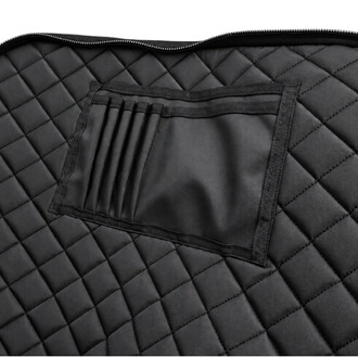 Sac matelassé noir pour plateau Apex de portique aérien, vue rapprochée sur la poche intérieure avec compartiments à sangles et fermeture zippée.