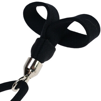 Bolas stick télécommandables Oddballs, avec une partie supérieure en cuir noir, formant deux boucles, et un connecteur métallique en bas.