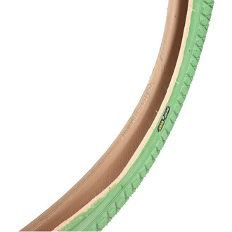 Pneumatico Qu-ax 20x1.95 verde chiaro con fianco beige, vista parziale che mostra il battistrada a blocchi.
