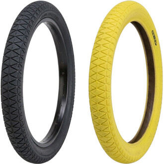 Pneus Qu-ax 18x1.75, pretos e amarelos, mostrados lado a lado com padrão de diamante na banda de rodagem.